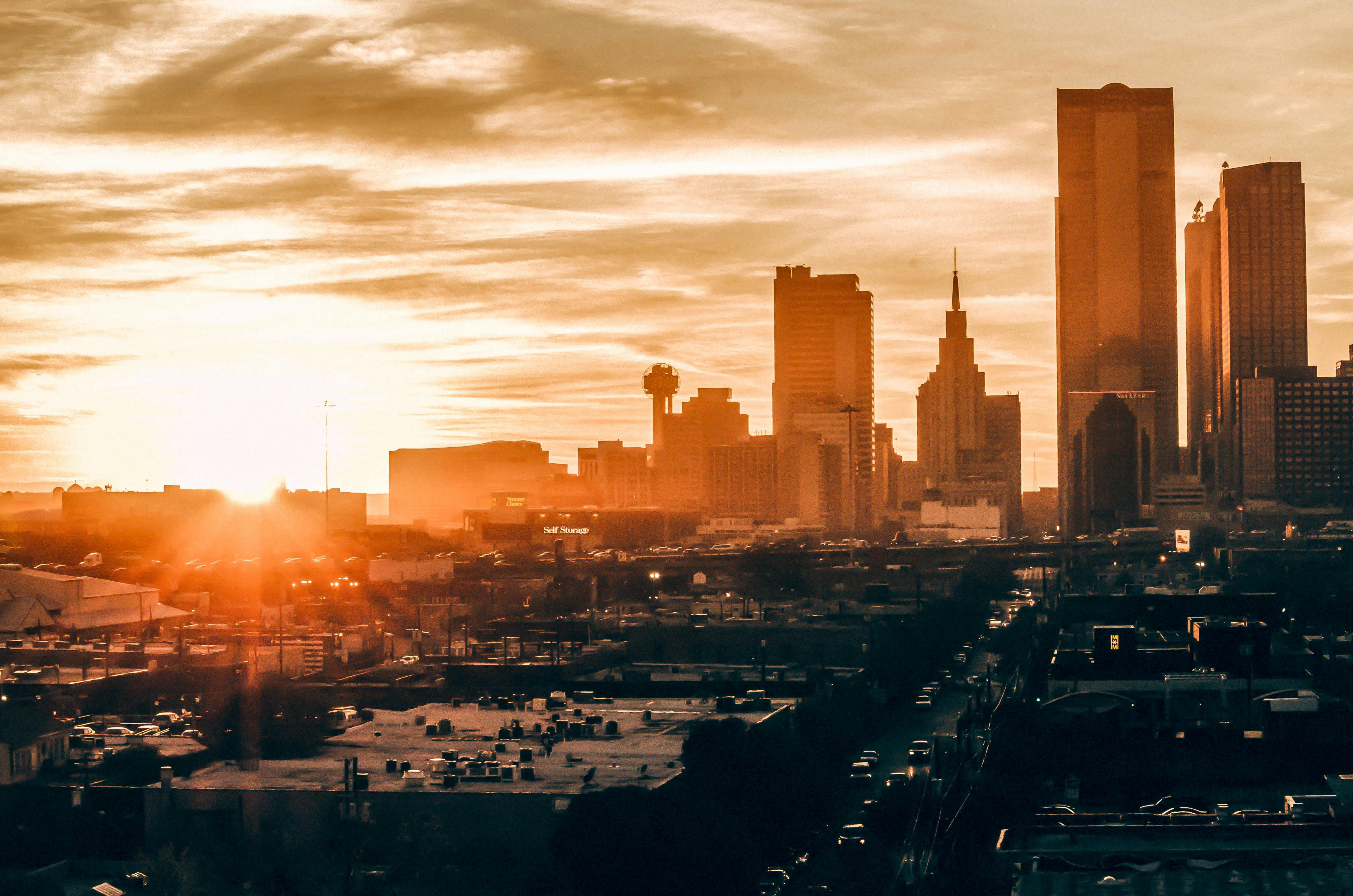 City skyline at golden hour representing neighborhood insights